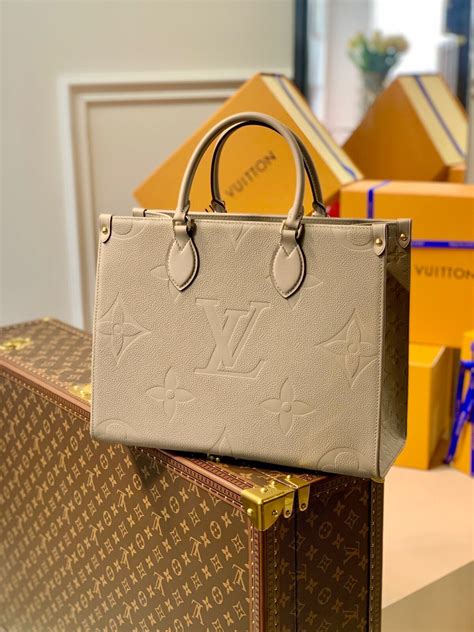 louis vuitton beige bag|Louis Vuitton small clutch bag.